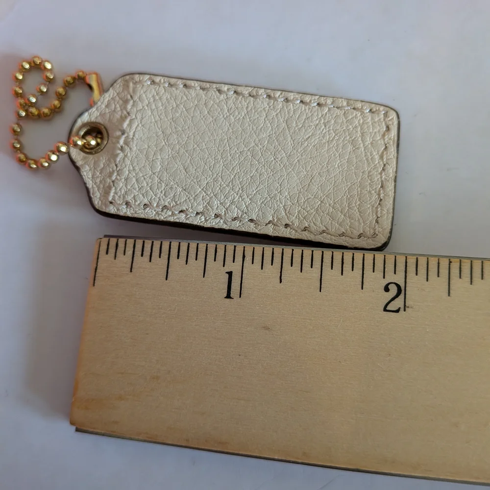 Coach White Pebbled‎ Leather Hang Tag in Cream with Gold Chain